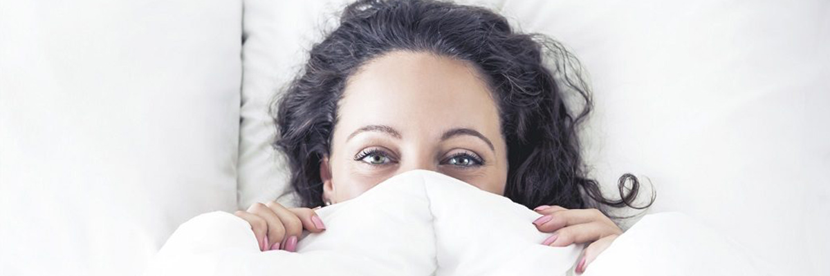 Woman in the Bed Hiding Face under Cover