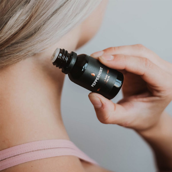 Peppermint Pure Essential Oil Application to Neck