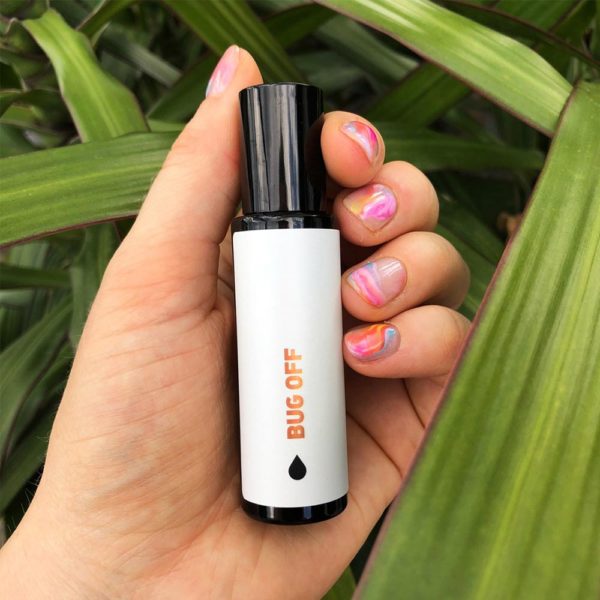 Pure Essential Oil Remedy Bug Off in Female Hand